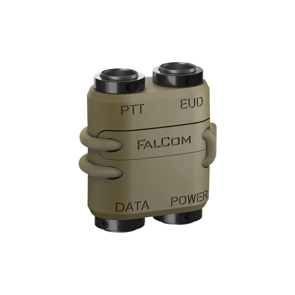FalCom Dock in color tan from front-left angle, four ports with words PTT, EUD, DATA and POWER.